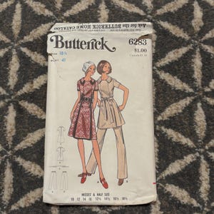 Peut inclure: Patron de couture Butterick vintage 6283 avec des illustrations de deux tenues féminines. Le patron comprend une robe et un tailleur-pantalon. Le tour de poitrine est de 104 cm, et le patron est pour les tailles Misses' & Half Size 10-18 1/2.