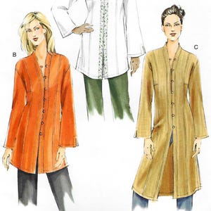 May include: Vogue Patterns sewing pattern V7854. The image shows three long-sleeved jacket designs. The pattern includes sizes 8, 10, and 12. The jackets are in white, orange, and tan. The Vogue logo is at the top.