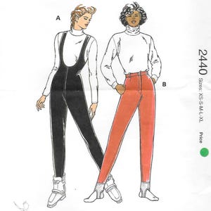 May include: A Kwik Sew pattern envelope 2440 for sizes XS-S-M-L-XL. The illustration shows two outfits: a black jumpsuit with a white turtleneck and a pair of red pants with a white turtleneck. The text includes the brand name Kwik Sew.