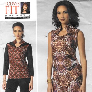 May include: A Vogue Patterns sewing pattern envelope for Today's Fit by Sandra Betzina, style V1429. The envelope displays two garment options: a long-sleeved top with a geometric print and black sleeves, and a sleeveless dress with a city-scape print.