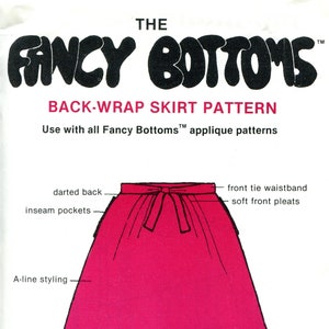 May include: A pink back-wrap skirt pattern for sewing. The pattern includes three sizes: Small (8-10), Medium (12-14), and Large (16-18). The skirt features a front tie waistband, soft front pleats, darted back, and inseam pockets.