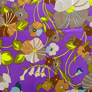 May include: A vibrant floral pattern on a purple background. The design features large flowers in shades of brown, tan, and blue, with yellow stems and green leaves. The overall aesthetic is reminiscent of vintage textile designs.