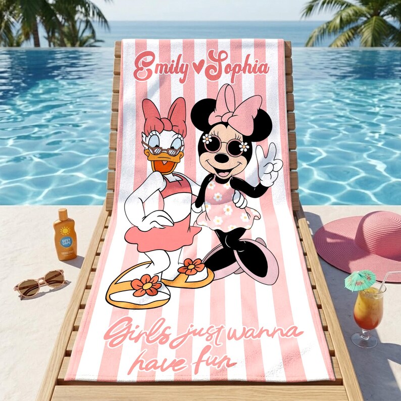 May include: A pink and white striped beach towel featuring Daisy Duck and Minnie Mouse in swimwear. The towel has the text "Emily Sophia" and "Girls just wanna have fun" in pink script.