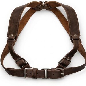 May include: A set of three ceramic mugs with a speckled, matte finish. The mugs are in cream, light grey, and dark grey. Each mug has a simple, minimalist design, ideal for coffee or tea.