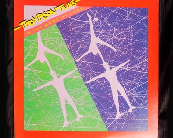 1981 Thompson Twins Album, In The Name Of Love / Mint cover, sleeve and record / ARISTA / Punk / 80s / AL 6601