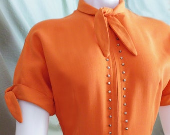 1950s Holy Grail Lucy Style Bright Orange cotton dress with brass studs, batwing sleeves, pockets, and matching hat, belt, and gloves