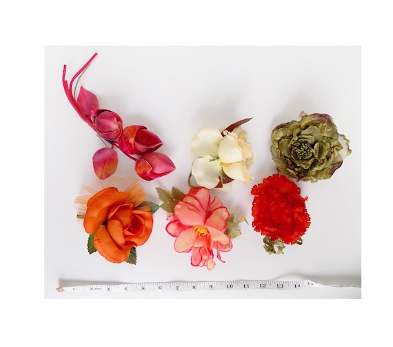 1950s-60s silk flowers (a set of 6) for hats, lapels, dresses, etc. Each is about 4" wide, and all have pins for attaching, and removing.