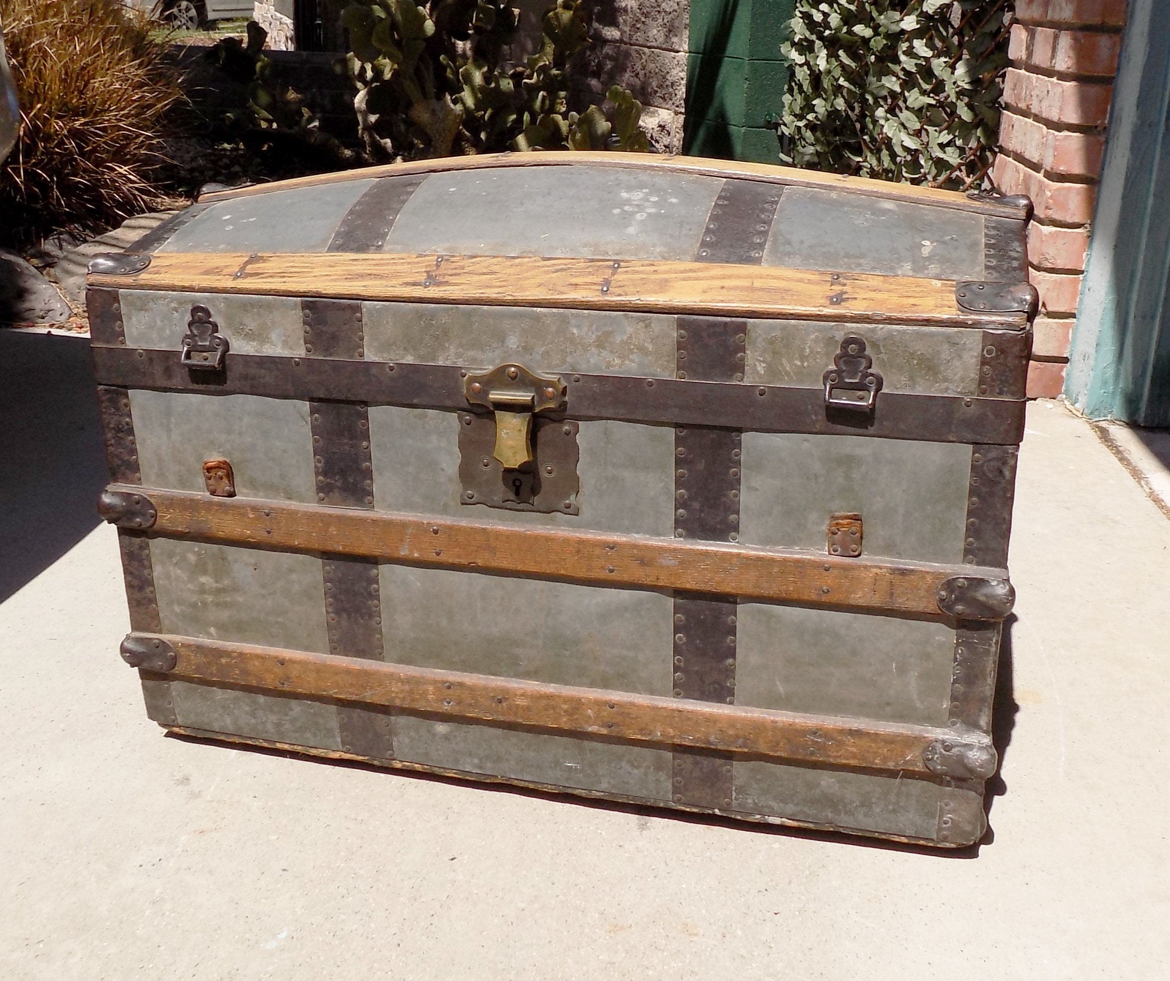 One of a kind steamer trunk made into a bar cart with some Scrap wood and  old horse yokes as legs