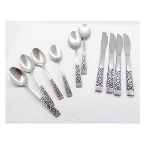1970s Stainless Steel,  4 knives, 4 teaspoons and 2 tablespoons / soupspoons, unknown pattern