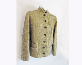 May include: A brown tweed jacket with a high collar and black buttons. The jacket has a single-breasted closure and two pockets.