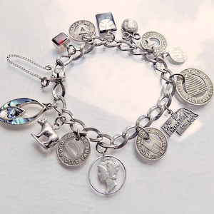 1960s Texas-transportation themed sterling silver BEAU charm bracelet, with safety chain and extras / Nebraska / Bear / Onyx