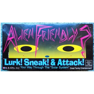 May include: A board game box titled "Alien Friendly?" with a black background and neon pink and yellow graphics. The text "Lurk! Sneak! & Attack!" is below the title. The game is for 2 to 6 players, ages 8 to adult.