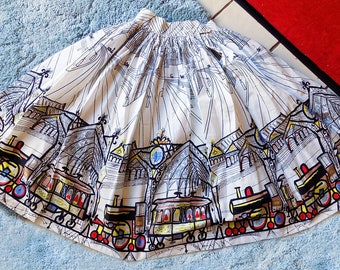 1950s Atomic Novelty Border Print Skirt design by Saul Steinberg, trains and trams, cartoon style, graphic, colorful, cotton,