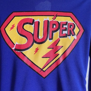 Vintage Super hero family costumes in three sizes, one girl 5-7, one girl 11-14, and two Large (boys)