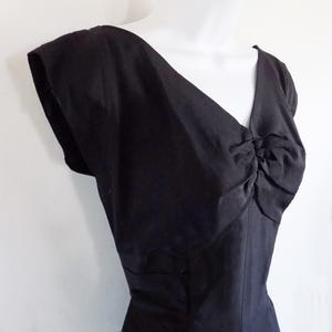 1950s cotton cocktail dress, perfect with a cute bolero jacket, fancy wrap, or accessories. Lightweight fabric, plunge back, metal zipper