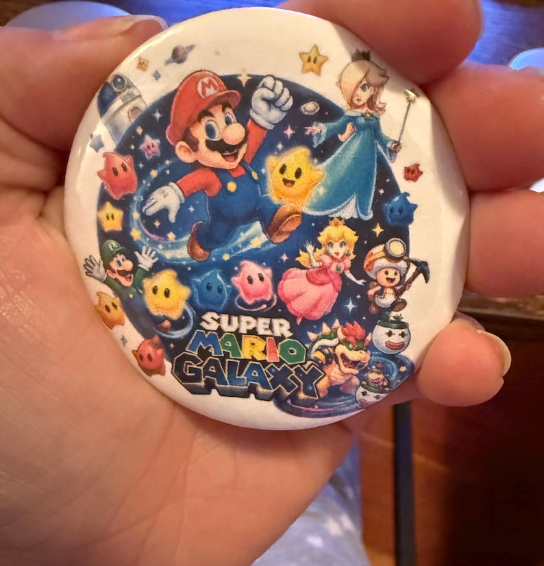 May include: A set of three ceramic mugs with a speckled, matte finish. The mugs are in shades of cream, light gray, and dark gray. Each mug has a simple, minimalist design and a rounded handle.