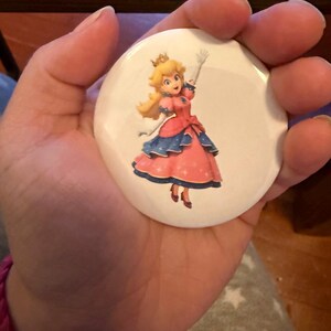 May include: A set of three ceramic mugs with a speckled, matte finish. The mugs are in shades of cream, light gray, and dark gray. Each mug has a simple, minimalist design, perfect for coffee or tea.