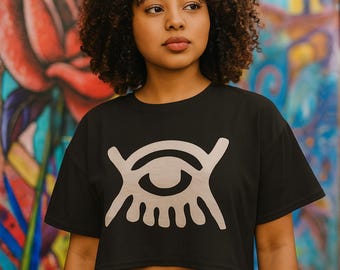 Krótki top z symbolem Adinkra – Abode Santann | Koszulka z grafiką kulturową | Moda afrocentryczna