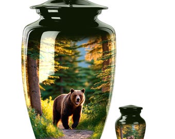 May include: A dark green urn and a smaller keepsake urn. Both feature a glossy finish and a scenic image of a brown bear walking on a path through a forest. The urns are designed for memorial purposes.