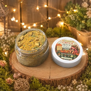 May include: A clear plastic jar filled with a yellow-brown powdered protein blend, accompanied by a white lid featuring a label that reads Pumpkin Patch Protein, Hermit Crab Nerd, Limited Edition Fall Harvest Blend, and Net Wt 4 oz (113g).