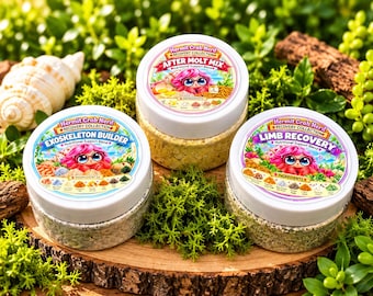 May include: Three round plastic jars with white lids containing nutritional support blends for hermit crabs. The labels feature a cartoon character with pink hair and the text Exoskeleton Builder, After Molt Mix, and Limb Recovery.