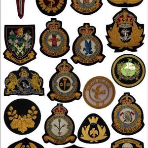 May include: A selection of embroidered badges and patches, showcasing various designs. The patches feature crests, emblems, and insignia with gold, red, blue, and white detailing. Some badges include text, such as "EX COELIS" and "SPECIAL BOAT SERVICE".