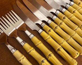 May include: A set of ten yellow bamboo handled stainless steel dinner knives and one matching fork.
