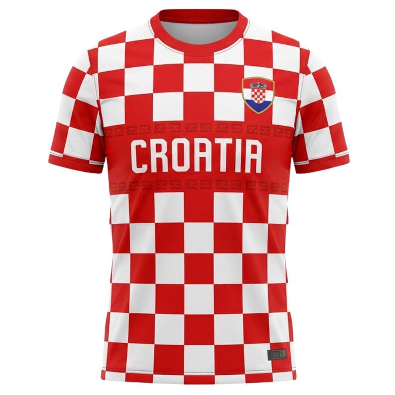 May include: Red and white checkered Croatia soccer jersey. The jersey features the word "CROATIA" in large white letters across the chest, with the Croatian coat of arms on the upper right chest. The sleeves and lower portion of the jersey have a checkered pattern.