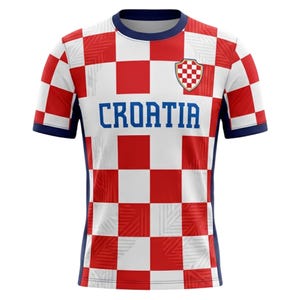 May include: A Croatia soccer jersey with a red and white checkered pattern. The jersey has blue accents on the collar, sleeves, and sides. The word "CROATIA" is printed in blue across the chest, with a team crest on the upper chest.