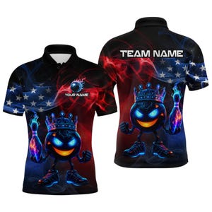 May include: Black polo shirt with a cartoon bowling ball character wearing a crown, glowing blue eyes, and trainers. The shirt has a red and blue smoke design with the text "YOUR NAME" and "TEAM NAME".