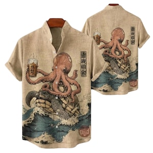 May include: Beige short-sleeved shirt featuring a Japanese-inspired design. The shirt showcases an octopus holding a beer, riding a turtle amidst waves. The back of the shirt mirrors the front design. Includes Japanese text.