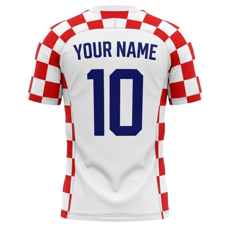 May include: White soccer jersey with red and white checkered accents on the sleeves and shoulders. The back features the number 10 in navy blue and the text "YOUR NAME" above it.