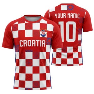 May include: A red and white chequered Croatia football shirt with the word "CROATIA" across the chest. The shirt features the Croatian coat of arms and the number 10 on the back, with space for a name.