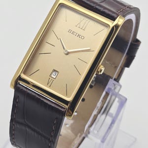 Orologio vintage Seiko slim: orologio da uomo con quadrante rettangolare, placcato in oro, cinturino in pelle marrone