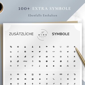 Puede incluir: Una hoja blanca con varios iconos negros y el texto "100+ EXTRA SYMBOLE" y "ZUS&Auml;TZLICHE SYMBOLE". Un bol&iacute;grafo dorado descansa sobre la hoja y una taza de caf&eacute; est&aacute; en la esquina superior izquierda.