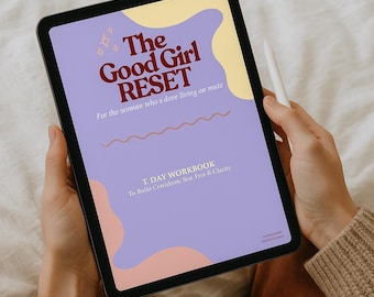 May include: A digital tablet displaying the title "The Good Girl RESET" in maroon lettering on a lavender background. The text "For the woman who's dove living on mute" is also visible. A stylus rests on the side.