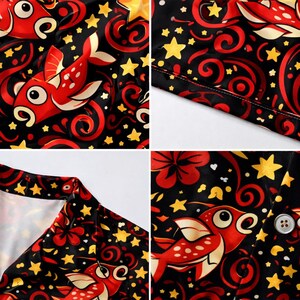 May include: A close-up of a black fabric with a repeating pattern of red fish, yellow stars, and red floral designs. The fish have large eyes and white spots. The fabric appears to be part of a shirt or similar garment.