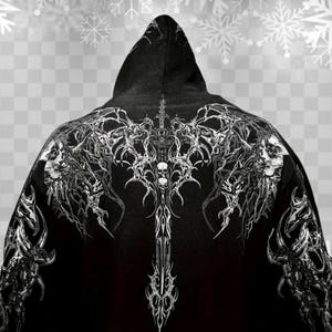 May include: Black hooded sweatshirt with a detailed white graphic design on the back. The design features skulls, a sword, and intricate patterns. The hood is up, and the background has a snowflake pattern.