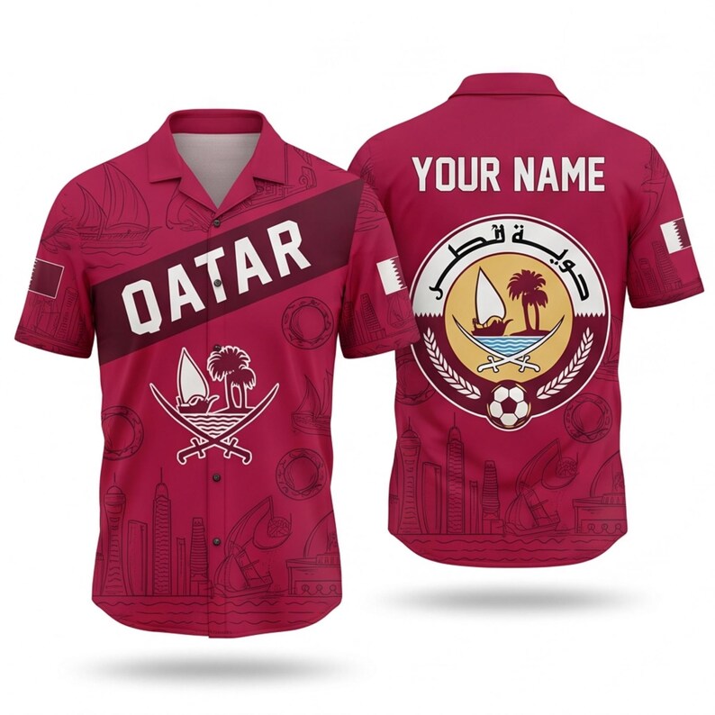 May include: A maroon button-up shirt featuring the word "QATAR" in white on the front. The shirt has a repeating pattern of boats and buildings. The back of the shirt displays the text "YOUR NAME" above a circular emblem.