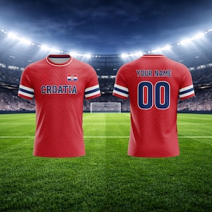 May include: Red football shirt with white and blue stripes on the sleeves. The front of the shirt displays the word "CROATIA" and the Croatian flag. The back of the shirt has the text "YOUR NAME" above the number "00".