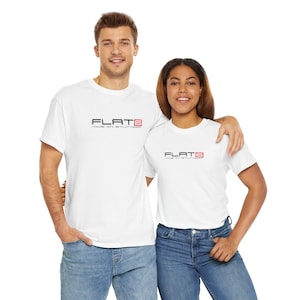 May include: Two people wearing white t-shirts with the text "FLAT6 MADE IN STUTTGART" in black and red. The shirts are paired with blue jeans. The image is taken from the waist up.