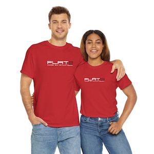 May include: Two people wearing red t-shirts with the text "FLAT6 MADE IN STUTTGART" in white. The shirts are short-sleeved and the people are wearing blue jeans. The background is white.