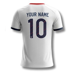 May include: White football shirt with the number 10 in navy blue and red stripes. The text "YOUR NAME" is above the number. The shirt has navy blue trim on the sleeves and a red collar.
