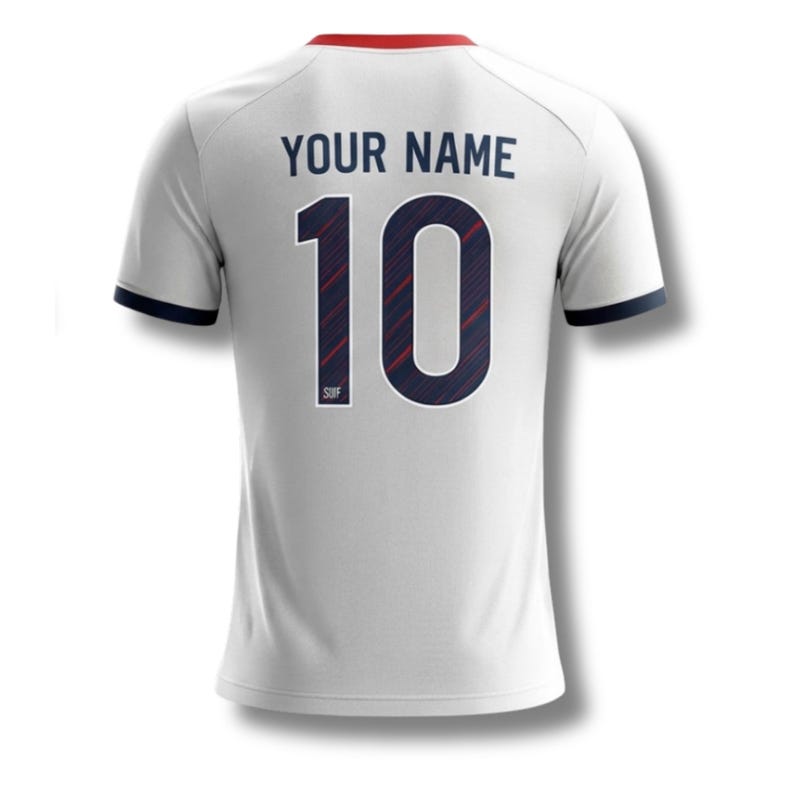 May include: White football shirt with the number 10 in navy blue and red stripes. The text "YOUR NAME" is above the number. The shirt has navy blue trim on the sleeves and a red collar.