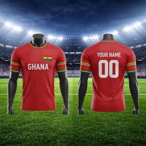 May include: Red football shirt with the word "GHANA" and the Ghana flag on the front. The back of the shirt has the text "YOUR NAME" above the number "00". The shirt has green and yellow trim.