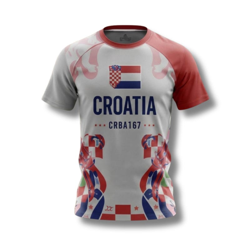May include: A grey and white Croatia football shirt with red sleeves and detailing. The shirt displays the Croatian flag and the word "CROATIA" in navy blue. The text "CRBA167" is also visible.