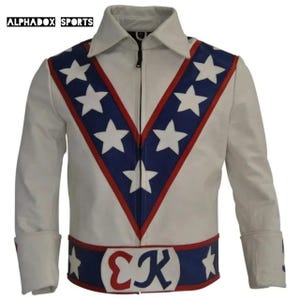 May include: White leather jacket with a zip-up front, a collar, and cuffs. The jacket features a blue and red V-shaped design on the chest and a band at the waist, both adorned with white stars. The text "ALPHADOX SPORTS" is visible at the top.