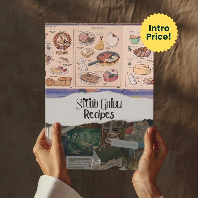 May include: A cookbook titled "Studio Ghibli Recipes" is held by a person. The cover features illustrated food items and a collage of images. A yellow starburst sticker reads "Intro Price!"