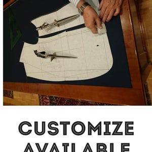 May include: A tailor's workspace with dark blue fabric, pattern pieces, and tools. Two silver seam rippers and a green set square are visible. The text "CUSTOMIZE AVAILABLE" is displayed below.