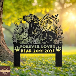 May include: Black metal garden stake featuring a dog with angel wings, surrounded by flowers. The text "FOREVER LOVED BEAR 2011-2025" is displayed below the dog, with paw prints on either side. The stake is designed for outdoor use.